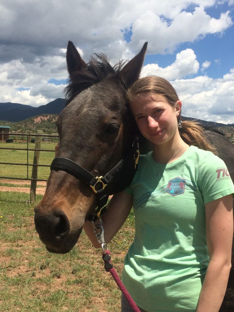 High School Rescue Club member with her horse