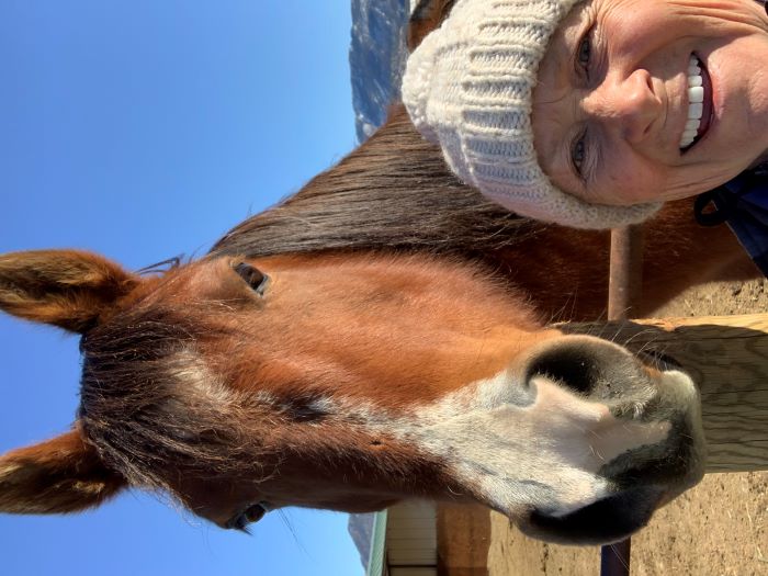 Volunteer Lori Pierce with a Rescue horse